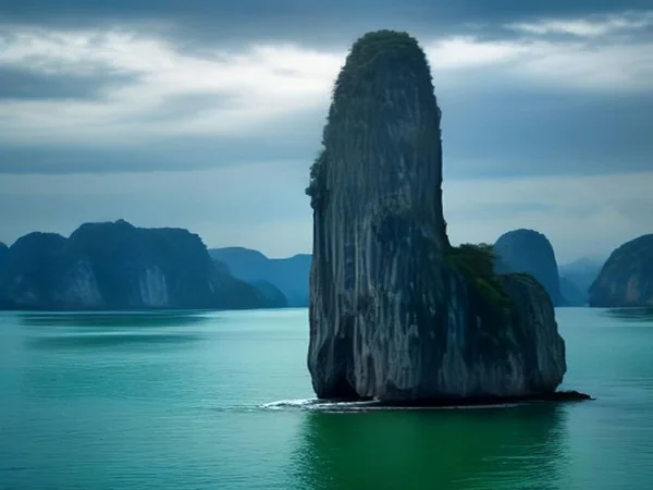 Limestone pinnacle of James Bond Island rising from green Phang Nga Bay water